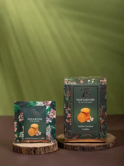 A naturally styled shot of Taste & Beyond cookie packaging on wooden discs, with soft, dappled lighting. This setup creates a warm, organic, and wholesome brand image.
