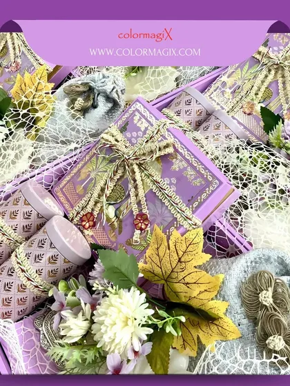 When love meets luxury. This stunning purple-themed wedding hamper is lavishly decorated with flowers, ribbons, and ornate jars, creating a truly breathtaking gift.