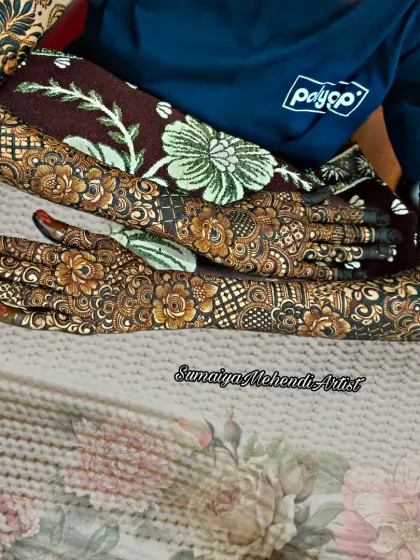 A full floral bridal design covering the hands, arms, and even the elbows. This is for the bride who wants a truly show-stopping mehendi look.