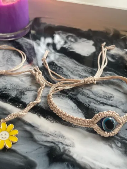 Celebrate the special bond of Raksha Bandhan with my handcrafted rakhis. This collection features unique designs like the cheerful smiley-face flower and the protective evil eye, knotted with love and care to make your festival memorable.
