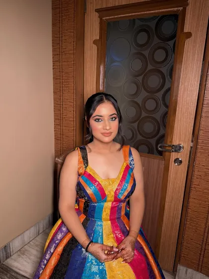 A fun and vibrant look for a party! The colorful dress is balanced with a soft glam makeup look, featuring a subtle smokey eye and a nude lip to keep the focus on the outfit.