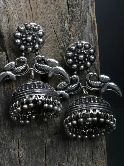 "Jhumke si sundar thi vo." These beautiful peacock oxidized jhumkas are a favorite, with their intricate carvings and classic design.