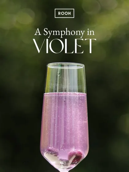 A symphony in violet. This sparkling floral cocktail is as beautiful as it is delicious, offering a sip of magic to start your evening.