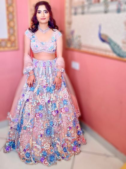 The final look for our gorgeous engagement bride. The pastel lehenga, soft glam makeup, and floral hair all come together to create a magical look.