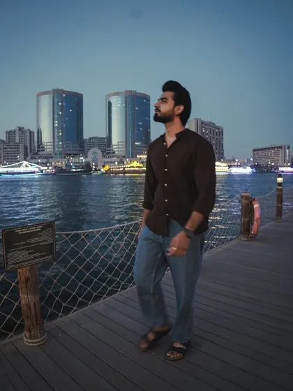 Walking along the pier in Dubai, taking in the sights. I believe in experiencing the destination to bring its flavor into the event.