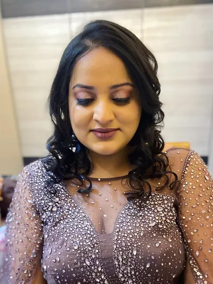 The complete look is soft, glamorous, and perfect for a cocktail party or reception.