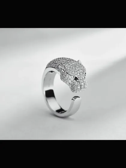 A modern and artistic panther head ring, meticulously crafted with pavé diamonds. This shot emphasizes the three-dimensional form and polished finish of the piece, perfect for showcasing unique and contemporary jewelry designs.