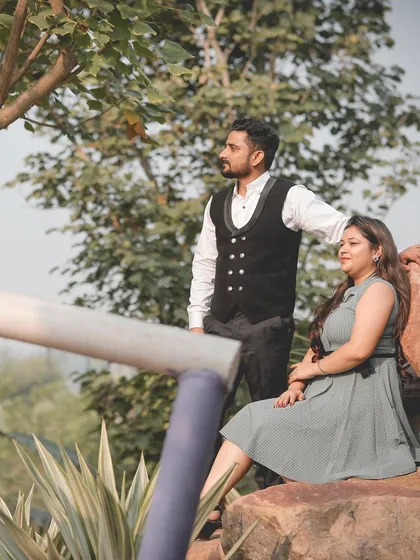 A relaxed and stylish portrait of a couple in a natural, outdoor setting during their pre-wedding shoot.