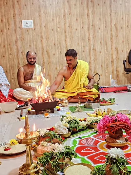 A family participating together in the Surya Homa ritual, highlighting the community and family-oriented nature of our events.