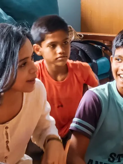 A beautiful, smiling shot of Megha Ray interacting with the children. Her warmth and engagement made the day unforgettable for everyone.