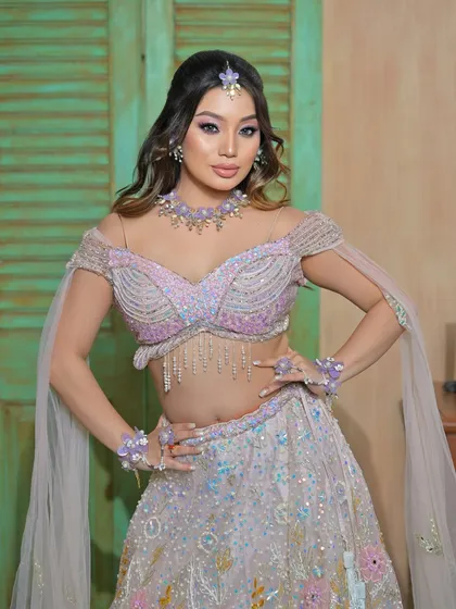 A powerful pose showing the full ensemble, perfect for an indo-western themed Mehendi or Sangeet.