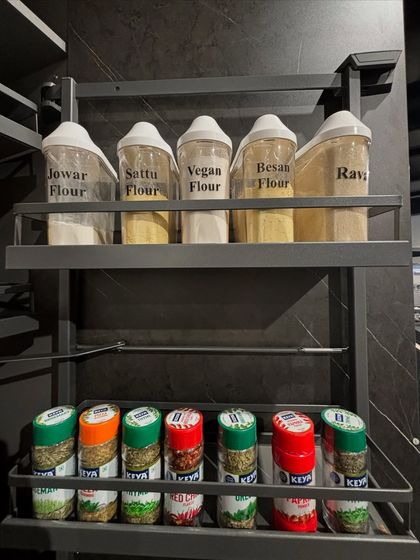 This hanging rack is a great way to utilize vertical space for flours and bottled spices. It keeps frequently used items off the counter but still within easy reach.