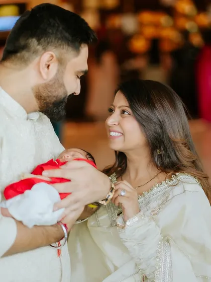 A beautiful portrait of a new family of three. Their joy and love for each other is so clear.