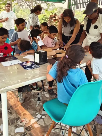 A group of young explorers busy with their space themed crafts. Our camps blend learning and creativity, making astronomy fun and accessible for all ages.
