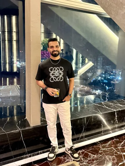 Down to earth, but still above you. A casual but stylish look for a night out in Mumbai with a great city view.