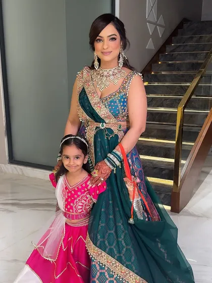 Mother and daughter, ready for the Mata Ki Chowki. Both look absolutely beautiful in their traditional attire.