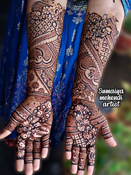 Another shot of this beautiful bridal mehendi against a royal blue fabric. The contrast really makes the intricate details of the henna pop.