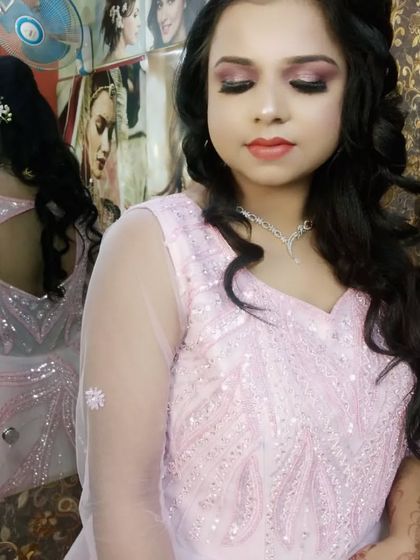 A close-up of the engagement makeup. You can see the shimmery eyeshadow and the soft curls in her hair.