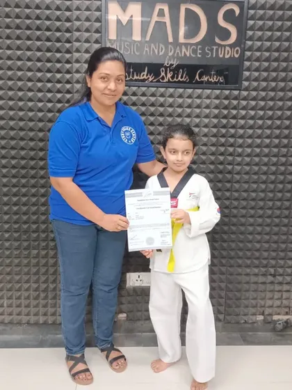 Another one of our students receives her certificate at our MADS Music and Dance Studio. We celebrate every child's progress and the effort they put into their training.