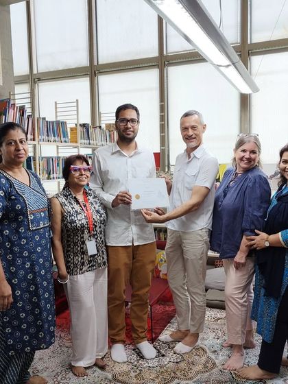 We honour a student who won 14th position in the prestigious Plume d'Or competition. This photo shows our teachers and directors celebrating the achievements of our talented students.