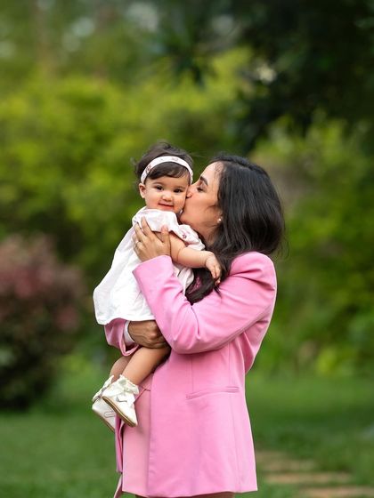 A sweet kiss for a sweet girl. These tender moments between a mother and her child are what make family photos so precious.