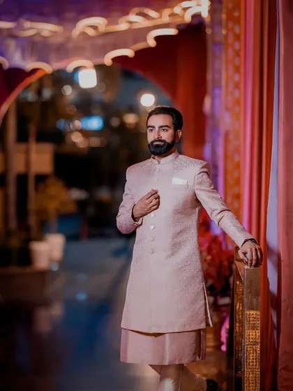 A handsome portrait of the groom in his pastel sherwani for the Roka ceremony, looking sharp and stylish.