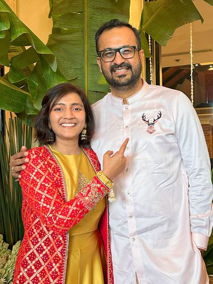 A client and his wife, proudly showing off the custom stag embroidery on his kurta. It's these personal touches that make a bespoke garment so special.