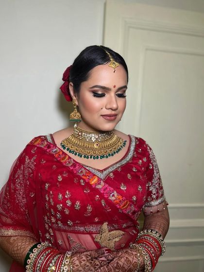 Eyes closed, this shot highlights the soft blending of the eyeshadow and the overall dewy finish of the makeup.