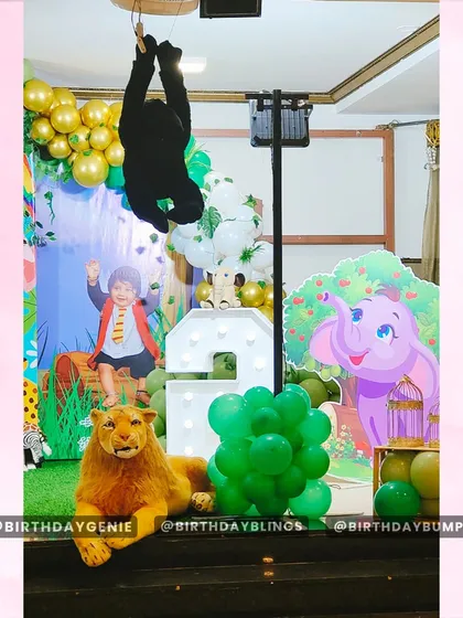 This angle highlights the Dumbo and lion props, along with the light-up number '2' that adds a celebratory glow to the jungle scene.