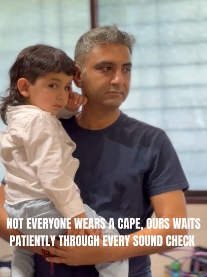 Not all heroes wear capes. Our co-founder Vivek waits patiently with a young performer during a sound check, showing the care and support that defines our team.