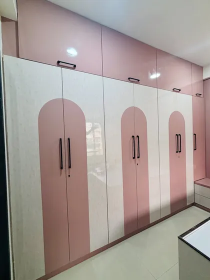 A wide shot showing the full expanse of the six-door wardrobe, offering immense storage capacity.