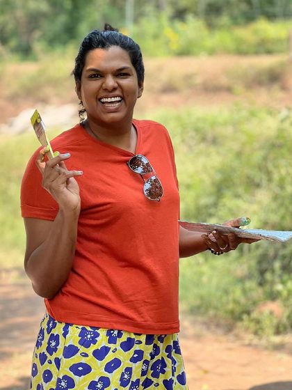 A happy participant at an outdoor painting event. The smiles and laughter are just as important as the art we create.