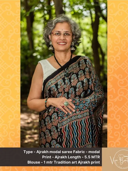 The beauty of Ajrakh lies in its intricate patterns and natural dyes. This modal saree showcases a stunning combination of wavy and floral block prints, perfect for a sophisticated, ethnic look.