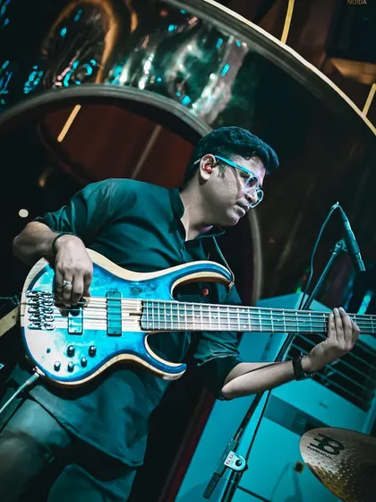 Our talented bassist, laying down the groove. The bass guitar adds depth and warmth to our sound, bridging the gap between traditional and contemporary instruments.