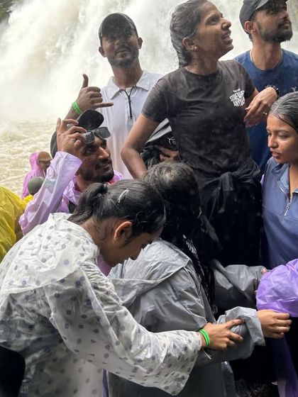 Helping each other through the misty base of Dudhsagar. Teamwork and camaraderie are a big part of our trekking adventures.
