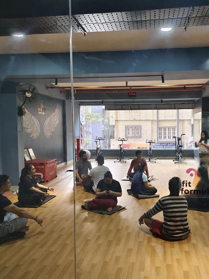 Another perspective of our meditation and OM chanting circle, seen through the studio glass. It's a calm and focused environment.