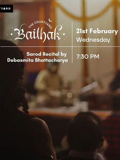 An audience member's view of a sarod recital by Debasmita Bhattacharya. The baithak setting allows for an immersive classical music experience.