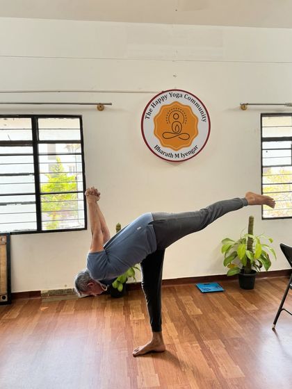 A student holds a variation of Virabhadrasana III (Warrior III). This pose is a true test of strength, balance, and focus, all of which are pillars of our teaching methodology.