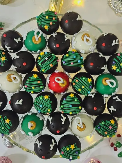 Our Christmas-themed chocolate truffles, decorated to look like festive ornaments. These bite-sized treats are perfect for gifting or adding a touch of elegance to your holiday dessert platter.