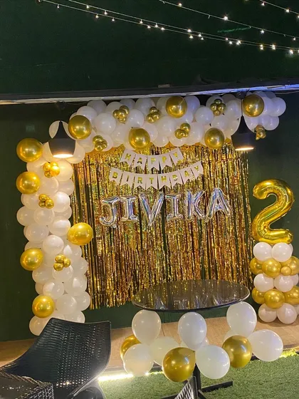 Another angle of the elegant white and gold second birthday decoration.