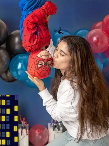 Even superheroes need a kiss from mom! I had so much fun with this creative Spiderman theme for a third birthday shoot. It's all about capturing your child's personality and passions.