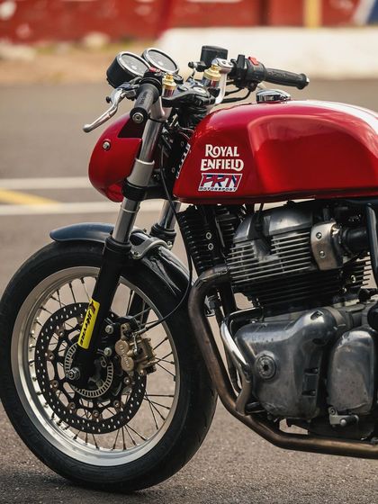 A close-up shot of the Royal Enfield Continental GT 650, showcasing its classic beauty and race-ready modifications. It's both a beauty and a beast.