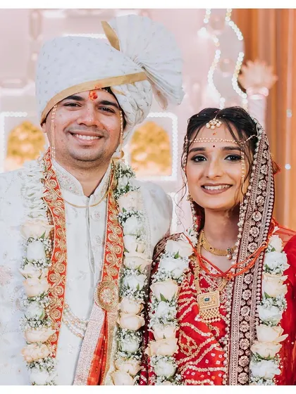 A beautiful portrait of the couple from a two-states wedding, where Vidhi wore a traditional Gujarati Panetar. Their smiles show the love that ties their cultures together.