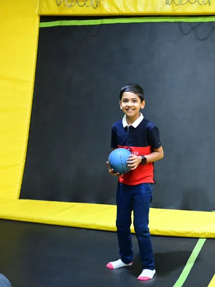 Our trampoline park isn't just for jumping; it's also great for a game of dodgeball. This guest is ready to play.