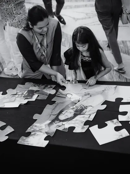 A custom jigsaw puzzle of the couple's photo for guests to assemble. We love incorporating fun, interactive elements that bring guests together and create lasting memories.