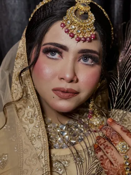 This portrait captures a powerful and intense gaze. The makeup enhances the model's features, creating a look that is both strong and beautiful.