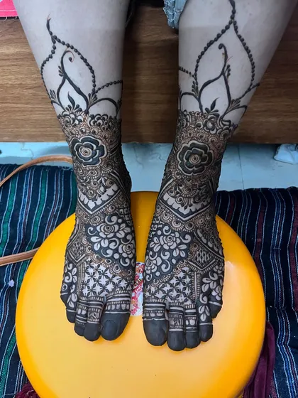 My bridal feet mehndi, designed with floral motifs and delicate net patterns to match my hands.