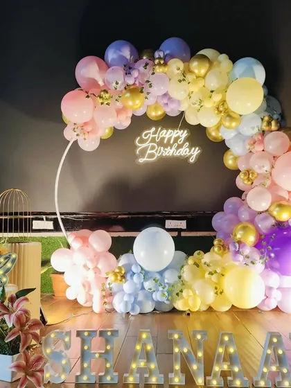 A duplicate of image 113, showing the complete pastel rainbow party decoration.