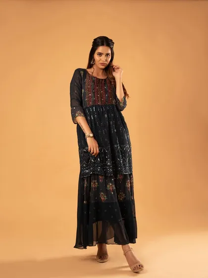 A full-length shot to display the entire layered ethnic dress.