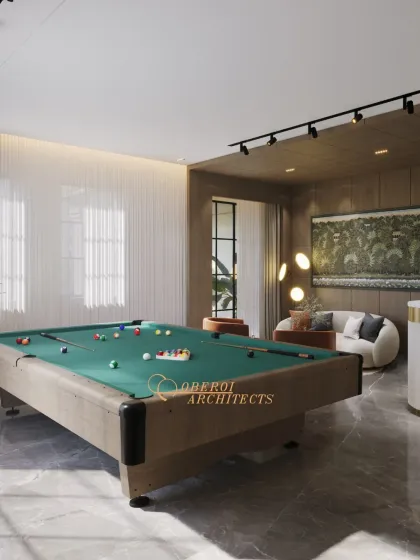 We design spaces that fit your lifestyle. This elegant game room, complete with a professional pool table and a comfortable lounge area, is the perfect setting for relaxation and entertainment.